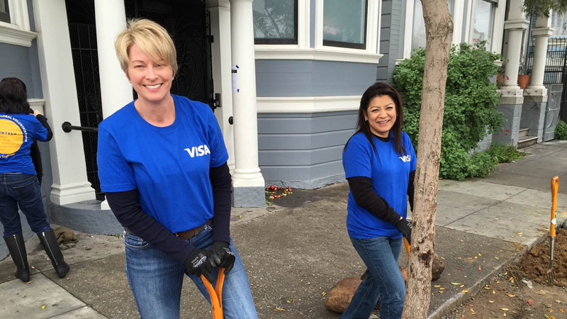 Visa volunteers landscaping in an urban setting. Visa volunteers landscaping in an urban setting.